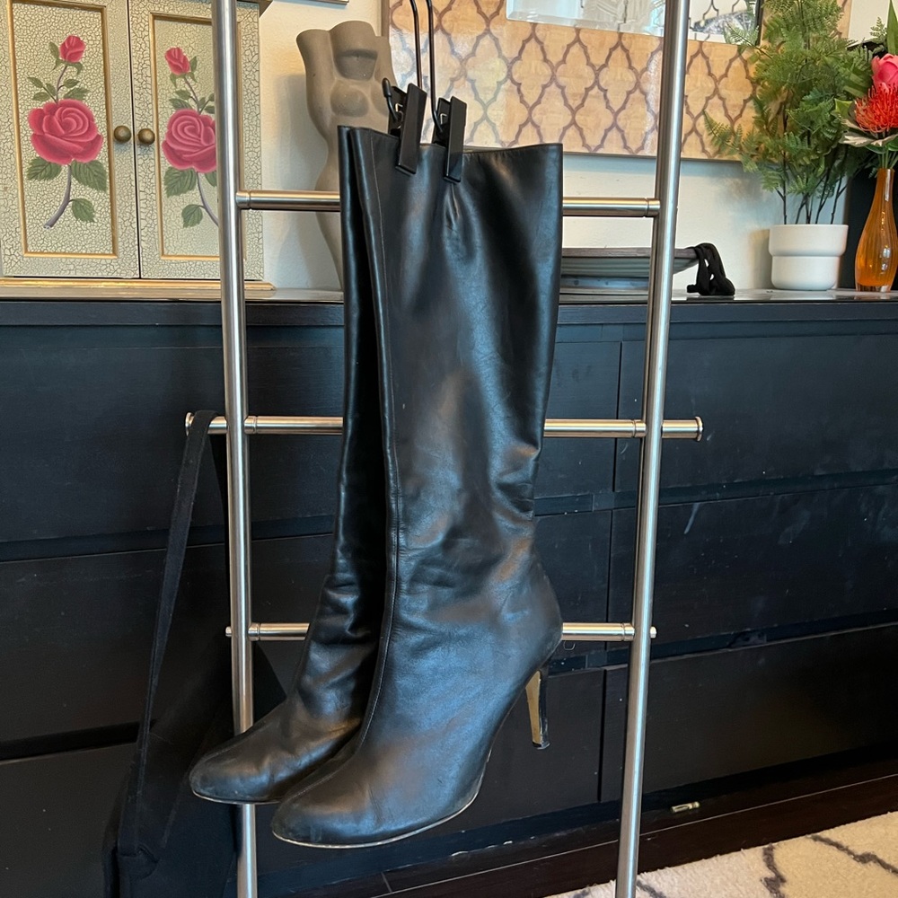 Very nice high heeled, black, stiletto boots. Very good condition